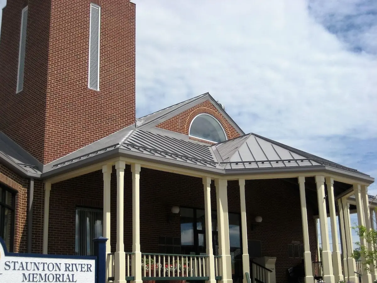 Skilled roofing craftsmen working on a residential roof in Benning